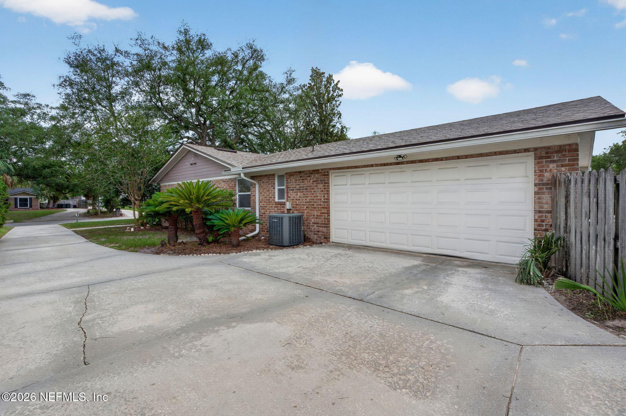 138 Ridgefield Court Orange Park, FL 32065 - Photo 51 of 64 a front view of house with garage