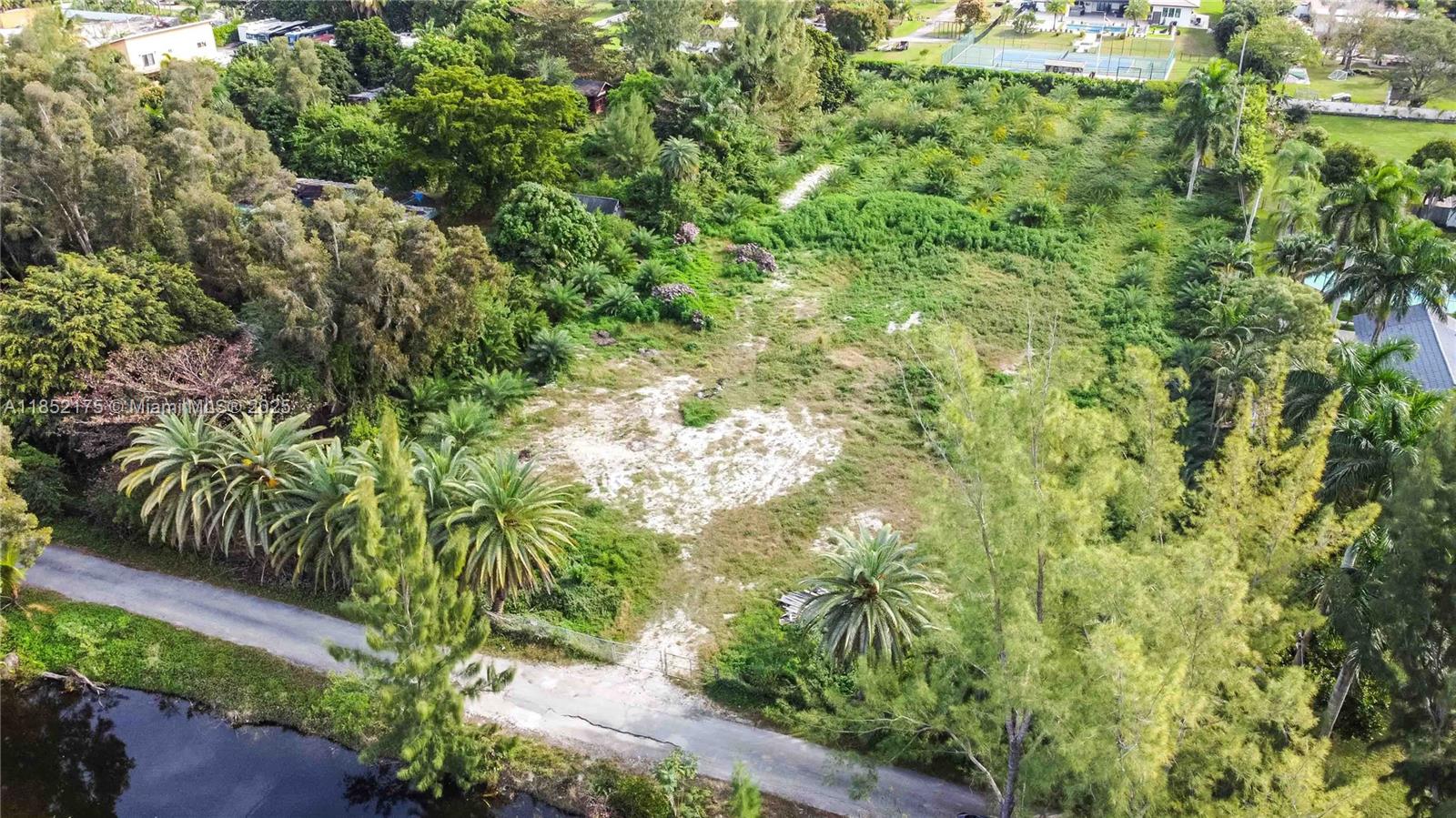 4001 Southwest 126th Avenue Miramar, FL 33027 - Photo 12 of 16 a view of a garden with a tree