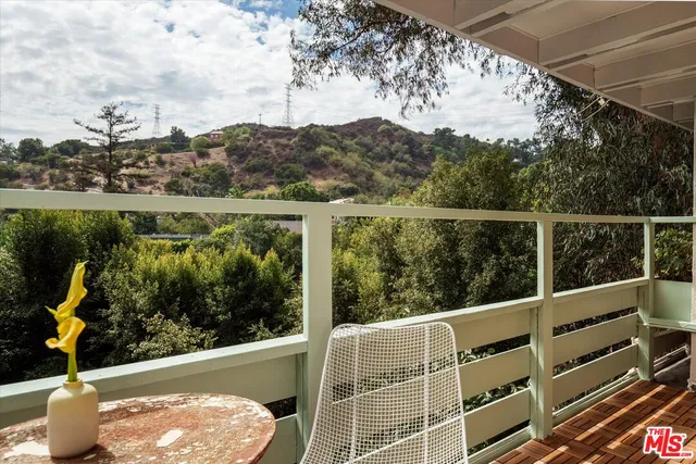a view of balcony with furniture