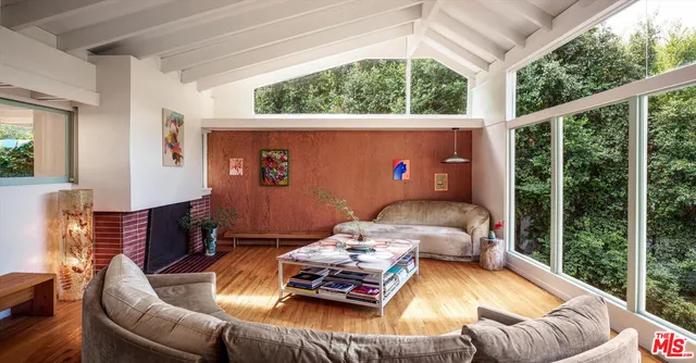 a bedroom with furniture and a window