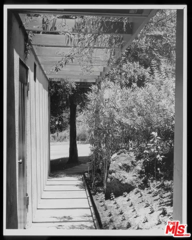 a view of living room and kitchen area