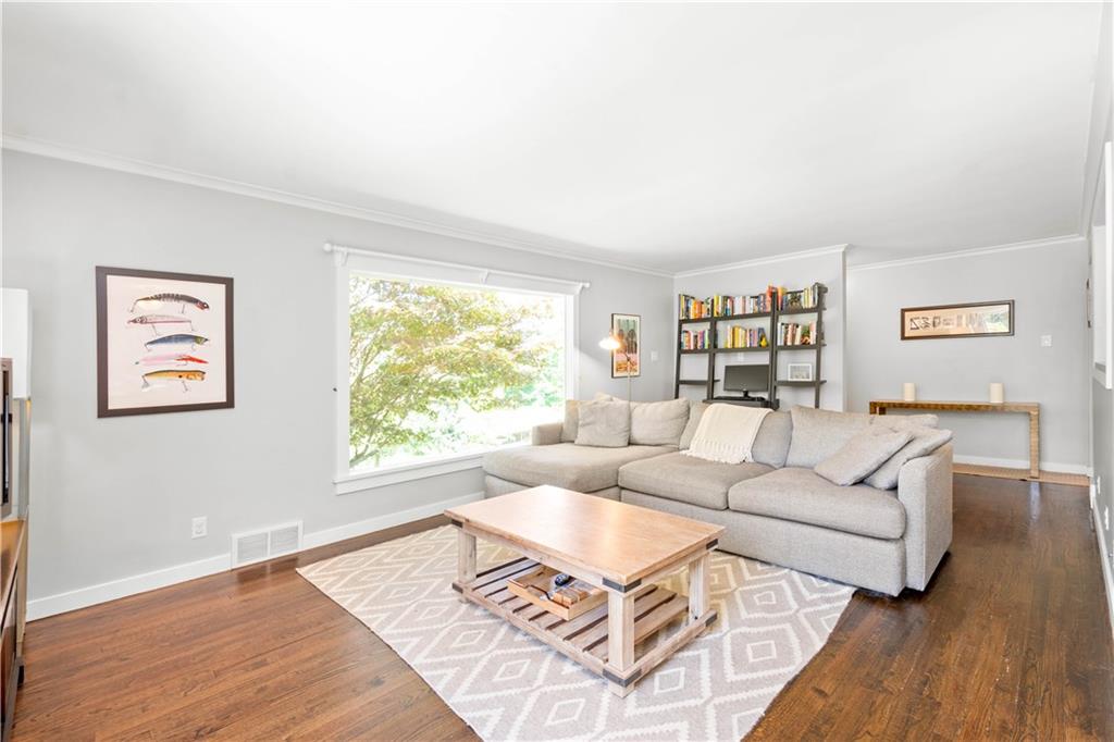 8 Thornridge Road Pittsburgh, PA 15202 - Photo 2 of 18 Refinished hardwood floors and neutral paint throughout the first floor make the space feel bright and modern. And the oversized picture window adds so much natural light to the living area!