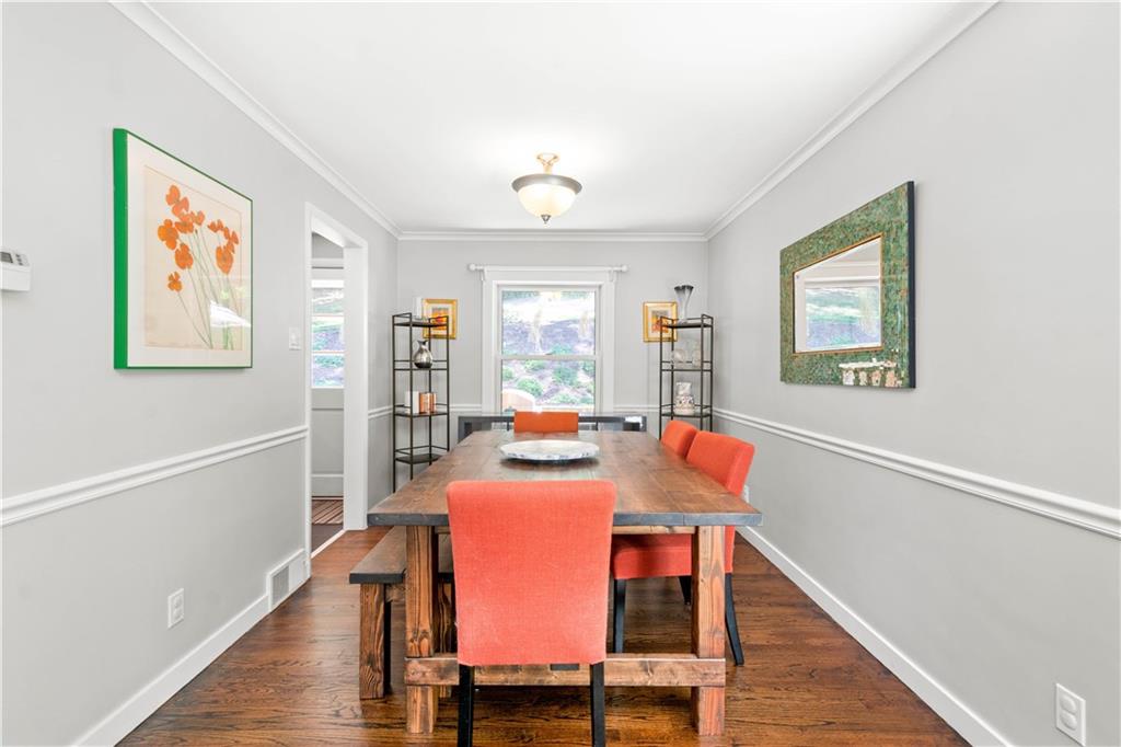 8 Thornridge Road Pittsburgh, PA 15202 - Photo 5 of 18 What a wonderful space to entertain guests! The chair rail and crown moulding elevate the space and the window overlooks the patio and backyard.