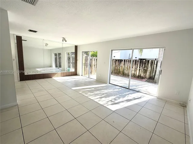a bathroom with a double vanity sink toilet and shower