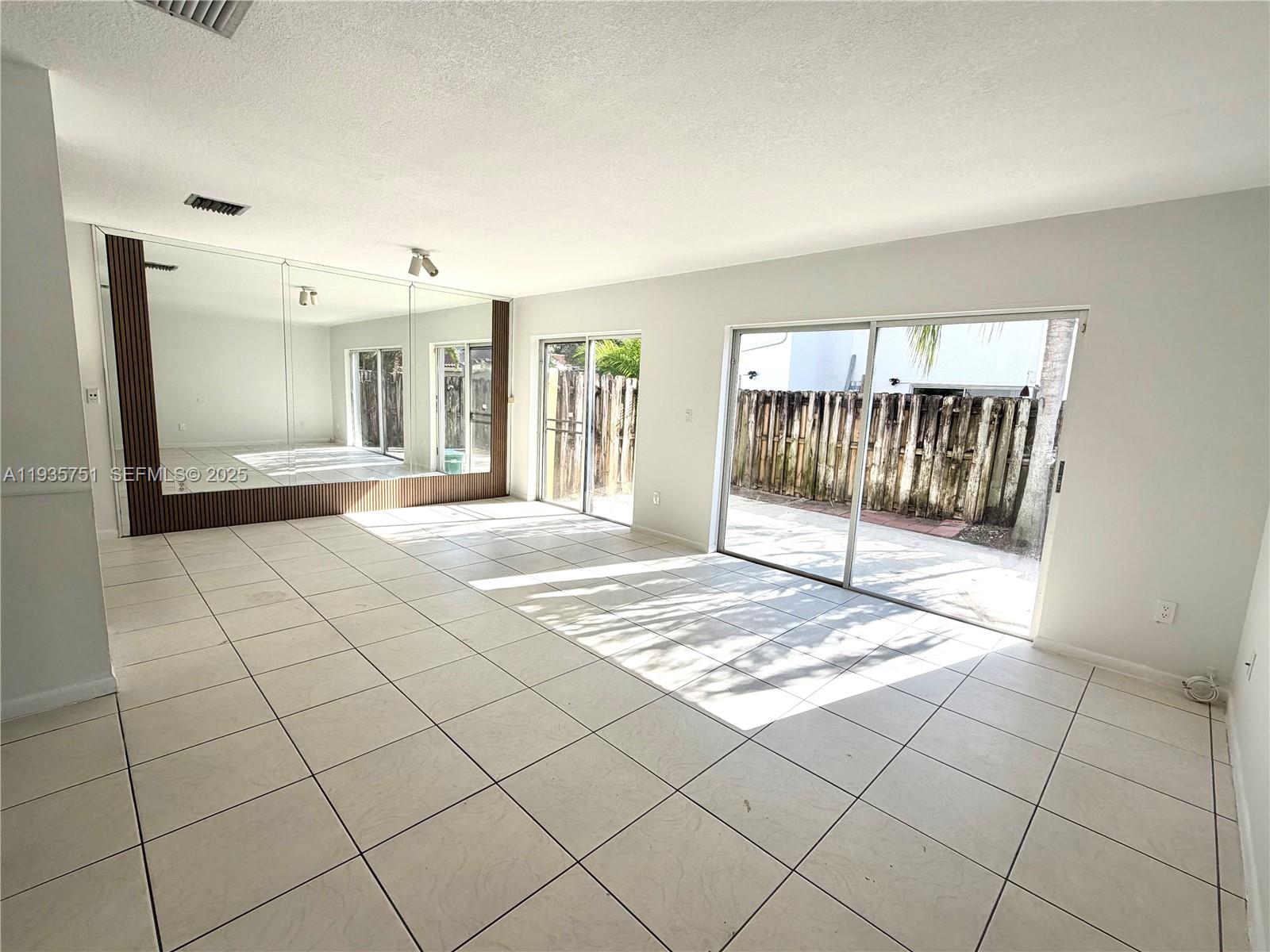 13922 Southwest 102nd Lane Miami, FL 33186 - Photo 11 of 20 a view of an empty room and window