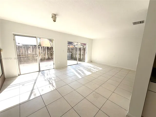 a view of livingroom with hardwood floor and ceiling fan