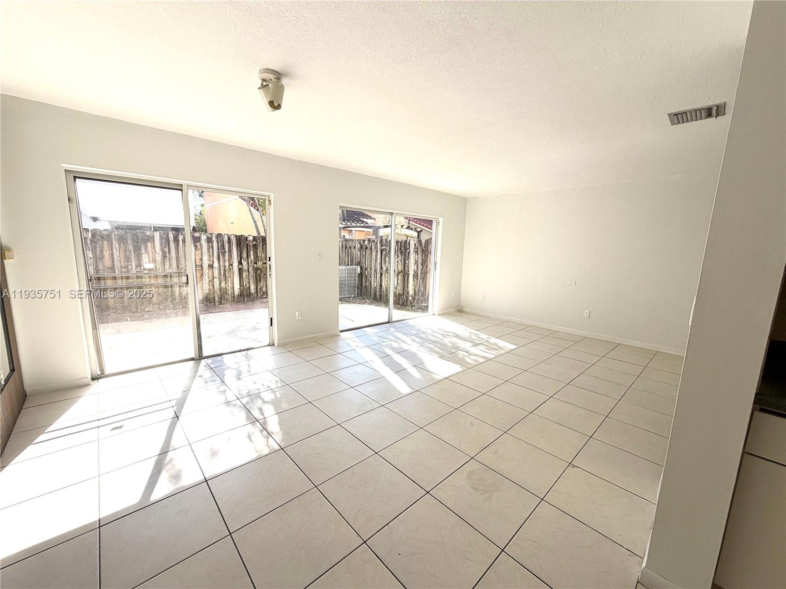 13922 Southwest 102nd Lane Miami, FL 33186 - Photo 12 of 20 a view of an empty room and window