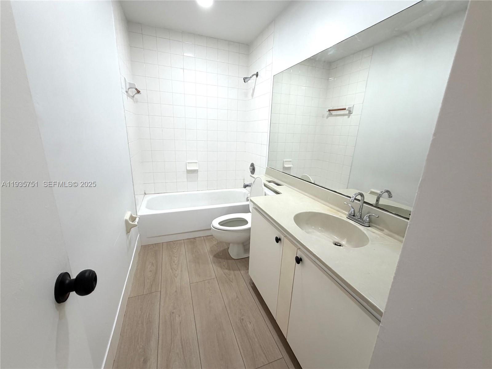 13922 Southwest 102nd Lane Miami, FL 33186 - Photo 13 of 20 a bathroom with a double vanity sink toilet and shower