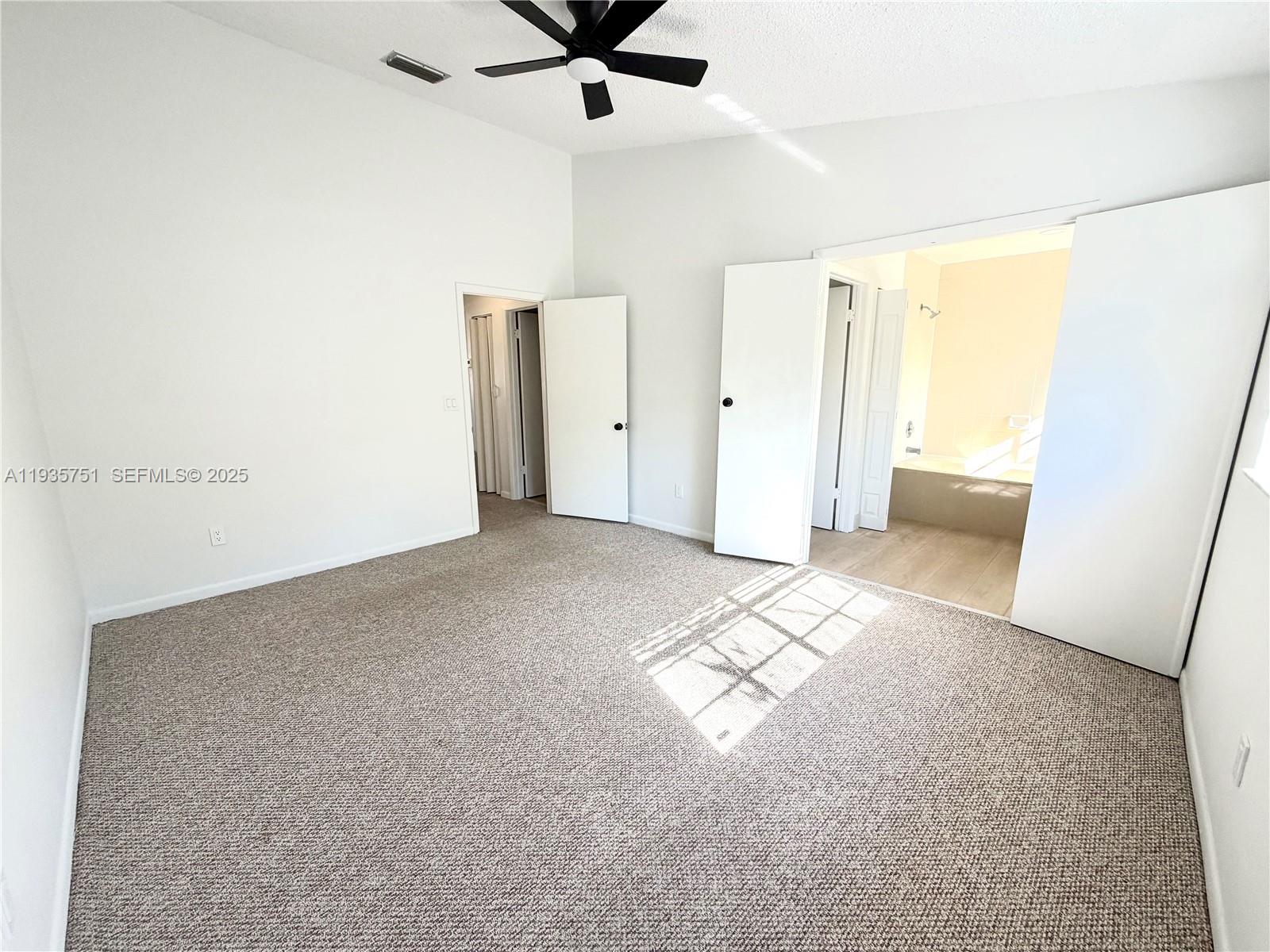 13922 Southwest 102nd Lane Miami, FL 33186 - Photo 14 of 20 a view of livingroom with hardwood floor and ceiling fan