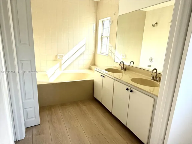 a view of a swimming pool with a fountain in front of house