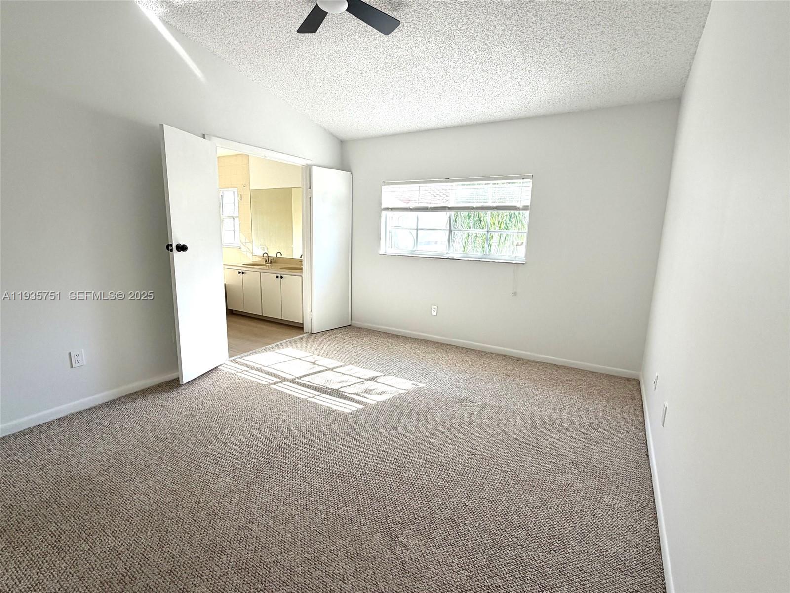 13922 Southwest 102nd Lane Miami, FL 33186 - Photo 16 of 20 an empty room with windows and entrance