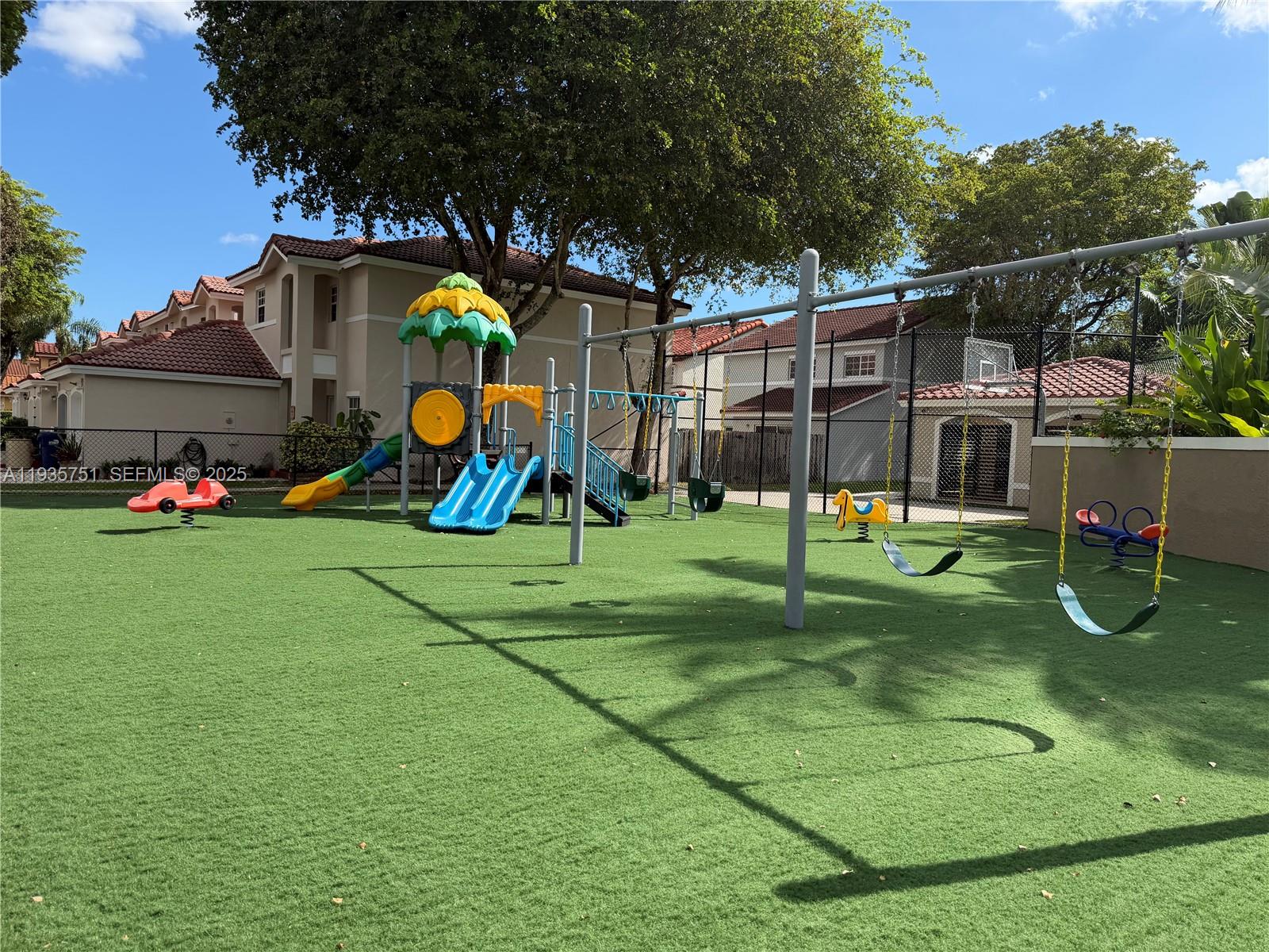 13922 Southwest 102nd Lane Miami, FL 33186 - Photo 20 of 20 a view of a park with swings