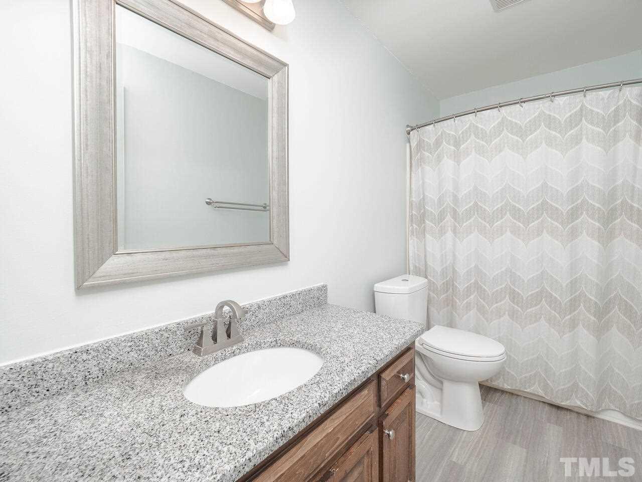 7108 Glendower Road Raleigh, NC 27613 - Photo 16 of 30 First floor hall bath