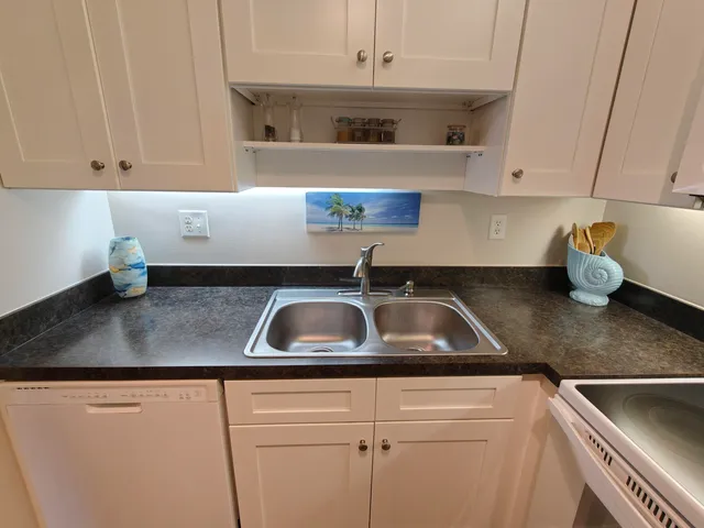 a kitchen with a sink and cabinets