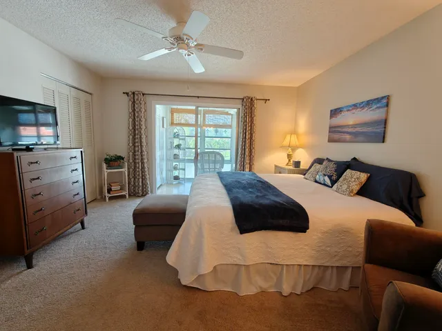 a bedroom with a bed and furniture