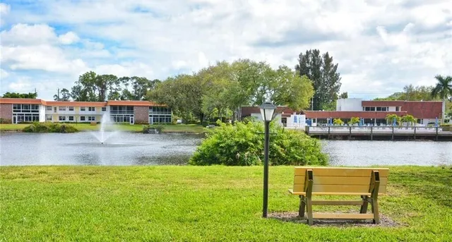 a view of swimming pool with outdoor seating and city view