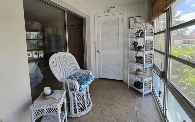 a view of entryway with furniture and rug