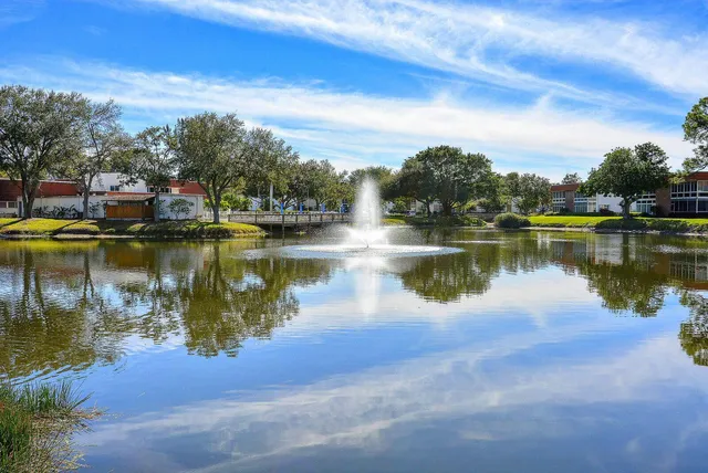 a view of a lake with houses in the back