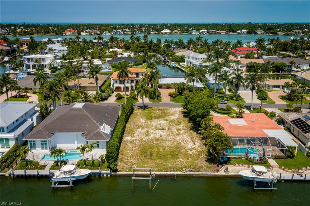 2165 Tarpon Road Naples, FL 34102 - Photo 12 of 24 an aerial view of residential houses with outdoor space and swimming pool