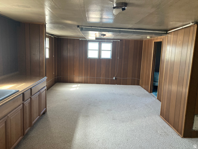 200 South 2800th Street West Ogden, UT 84404 - Photo 15 of 42 Basement with wood walls and light carpet