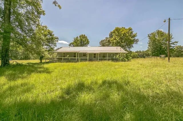 a view of a swimming pool with an outdoor space and seating area