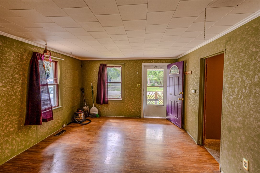 1750 North 31st Street Decatur, IL 62526 - Photo 6 of 12 a view of empty room with wooden floor and fan