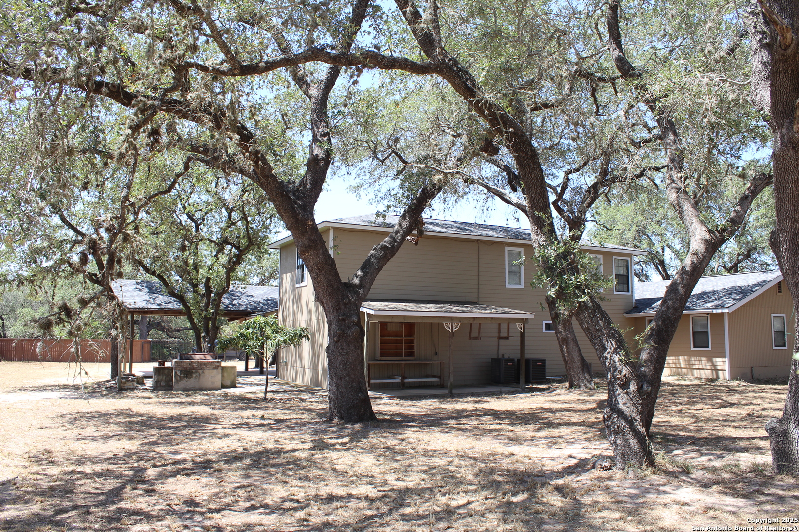 24590 Trumbo Road San Antonio, TX 78264 - Photo 4 of 34 a view of a trees and tree in front of a house