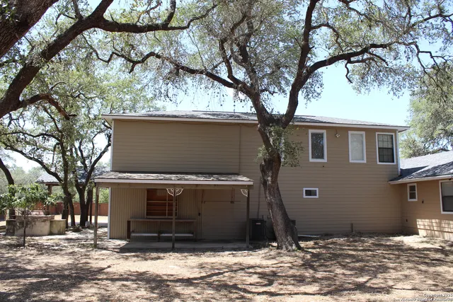 a view of a house with a tree