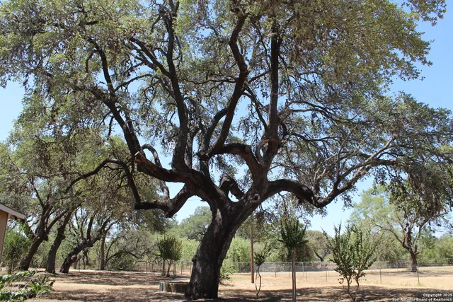 a swimming pool with outdoor seating and yard