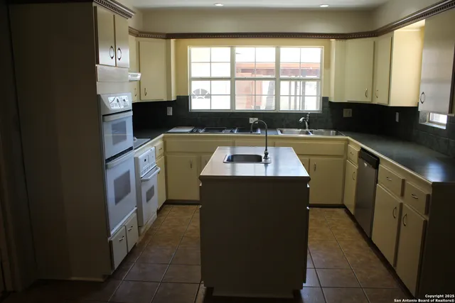 a view of storage and utility room with empty racks
