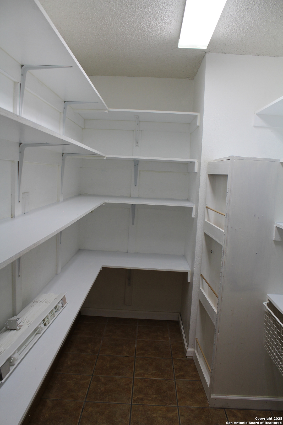 24590 Trumbo Road San Antonio, TX 78264 - Photo 10 of 34 a view of storage and utility room with empty racks