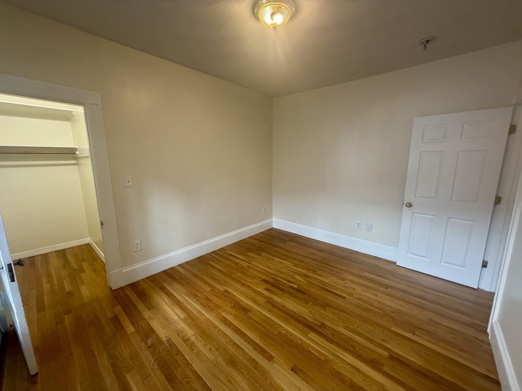 19 Banks Street, Unit 1 Somerville, MA 02144 - Photo 12 of 16 a view of room with wooden floor