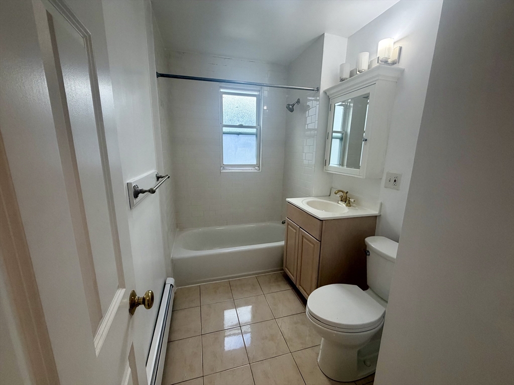 19 Banks Street, Unit 1 Somerville, MA 02144 - Photo 16 of 16 a bathroom with a sink toilet and shower