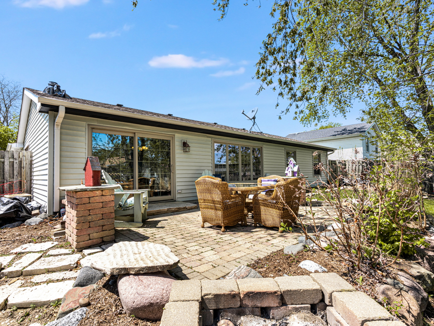 302 Delaware Drive Bolingbrook, IL 60440 - Photo 19 of 21 a view of a patio with table and chairs and potted plants