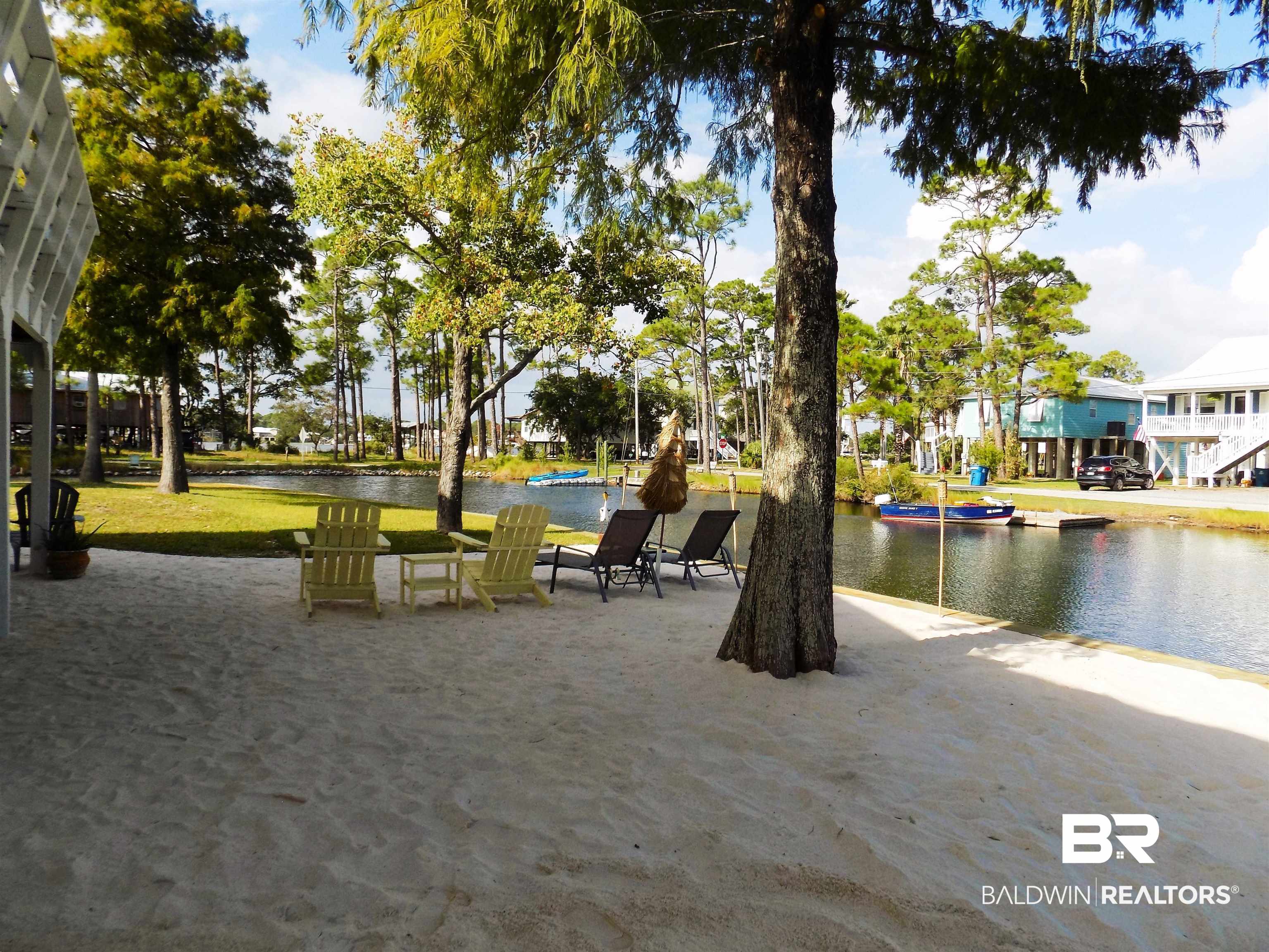304 Windmill Ridge Road Gulf Shores, AL 36542 - Photo 2 of 29 View of property's community with a patio area and a water view