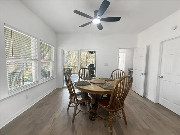 a view of a dining room with furniture window and wooden floor