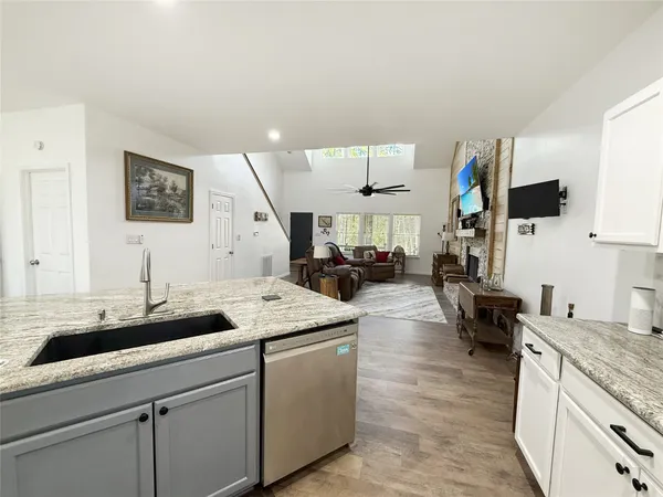 a kitchen with a sink and cabinets