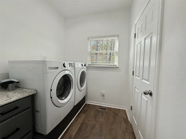 a utility room with dryer and washer