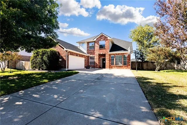 a view of house with yard
