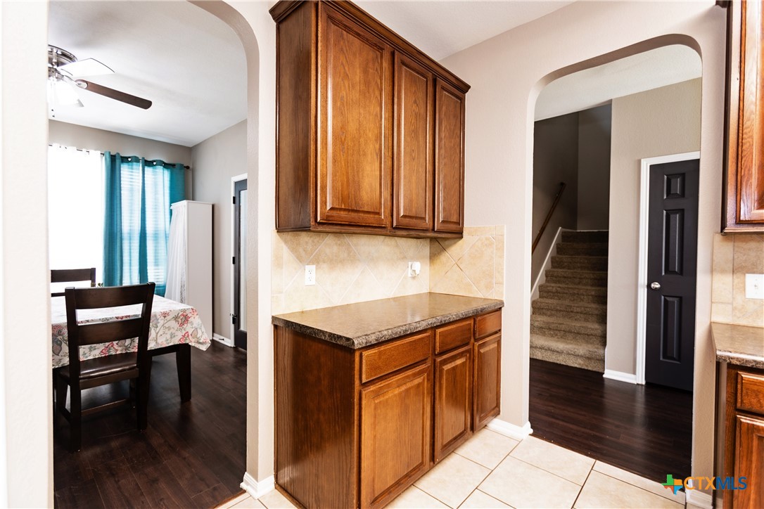 612 Pumpkin Drive Temple, TX 76502 - Photo 13 of 33 a kitchen with stainless steel appliances granite countertop a stove and a refrigerator