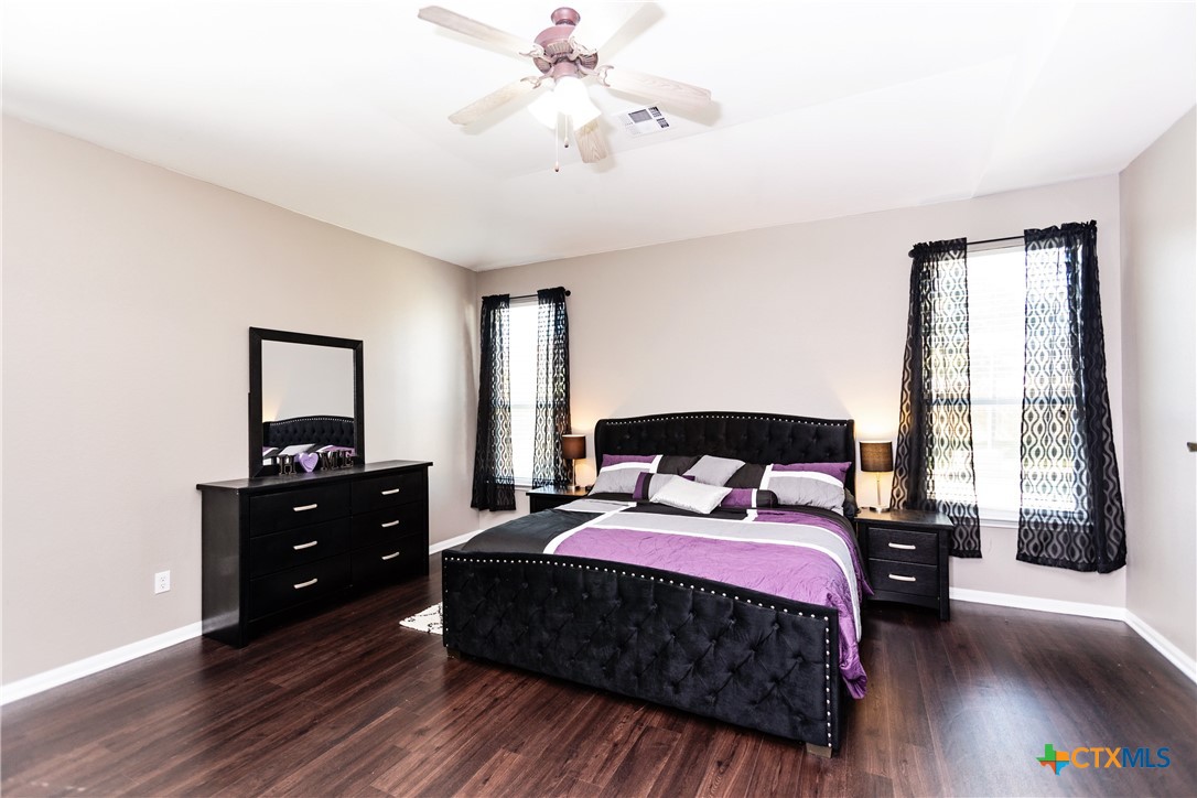 612 Pumpkin Drive Temple, TX 76502 - Photo 16 of 33 a bedroom with a bed and a tv on the dresser