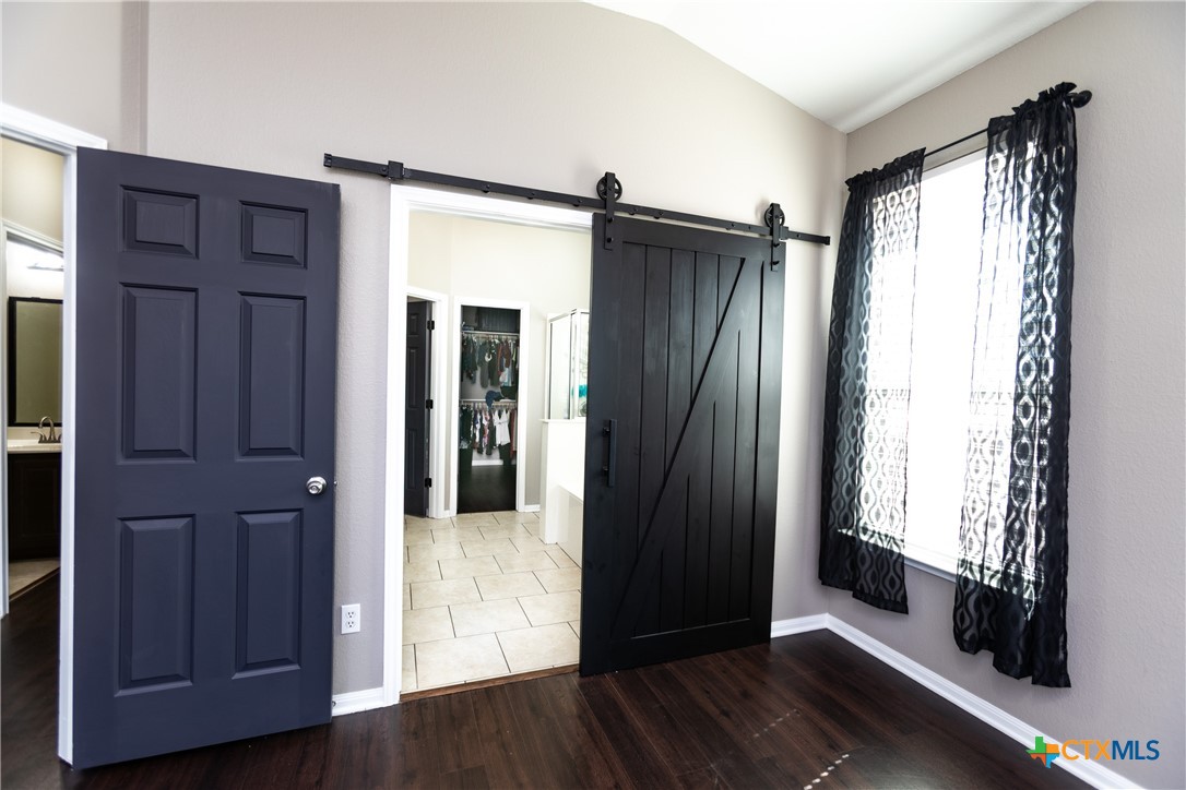 612 Pumpkin Drive Temple, TX 76502 - Photo 17 of 33 wooden floor and windows in an empty room