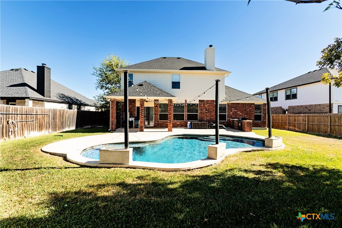 612 Pumpkin Drive Temple, TX 76502 - Photo 2 of 33 a view of a swimming pool with a patio