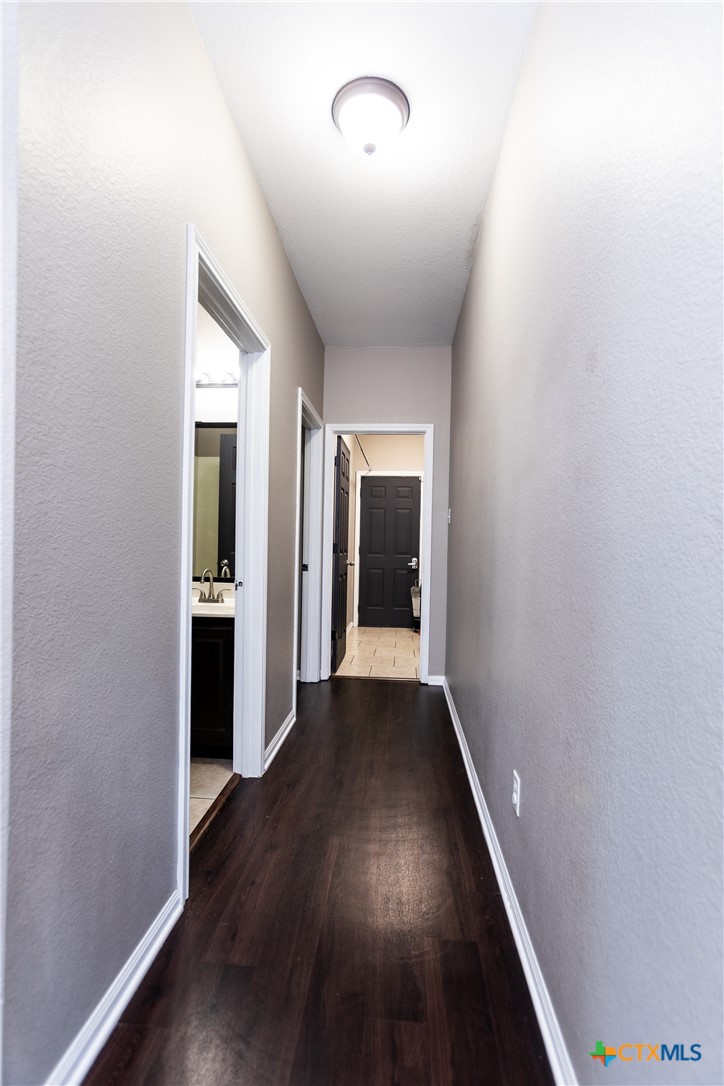 612 Pumpkin Drive Temple, TX 76502 - Photo 21 of 33 wooden floor in an empty room with a window
