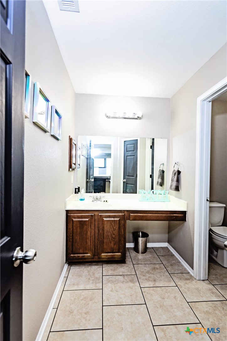 612 Pumpkin Drive Temple, TX 76502 - Photo 28 of 33 a view of living room with granite countertop furniture and fireplace