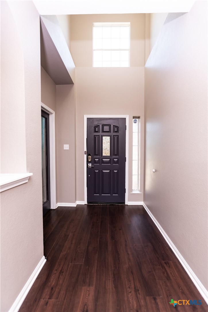 612 Pumpkin Drive Temple, TX 76502 - Photo 29 of 33 a view of a big room with wooden floor windows and cabinet
