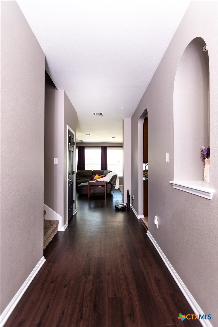 612 Pumpkin Drive Temple, TX 76502 - Photo 4 of 33 a view of a livingroom with wooden floor and furniture