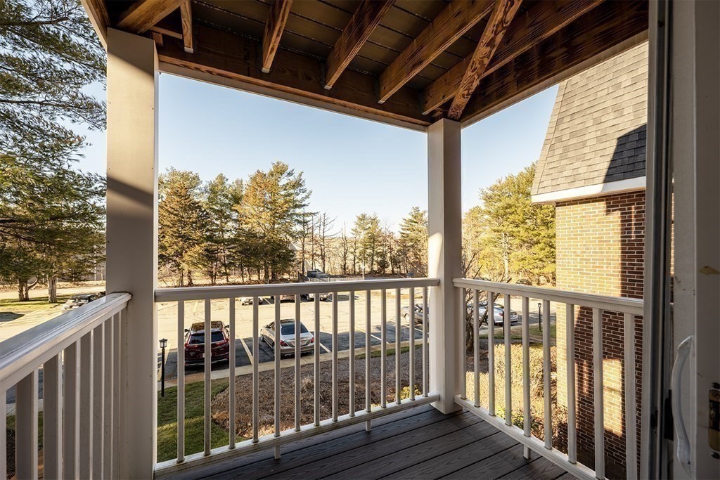 57 Will Drive, Unit 170 Canton, MA 02021 - Photo 12 of 15 a view of a porch with wooden floor