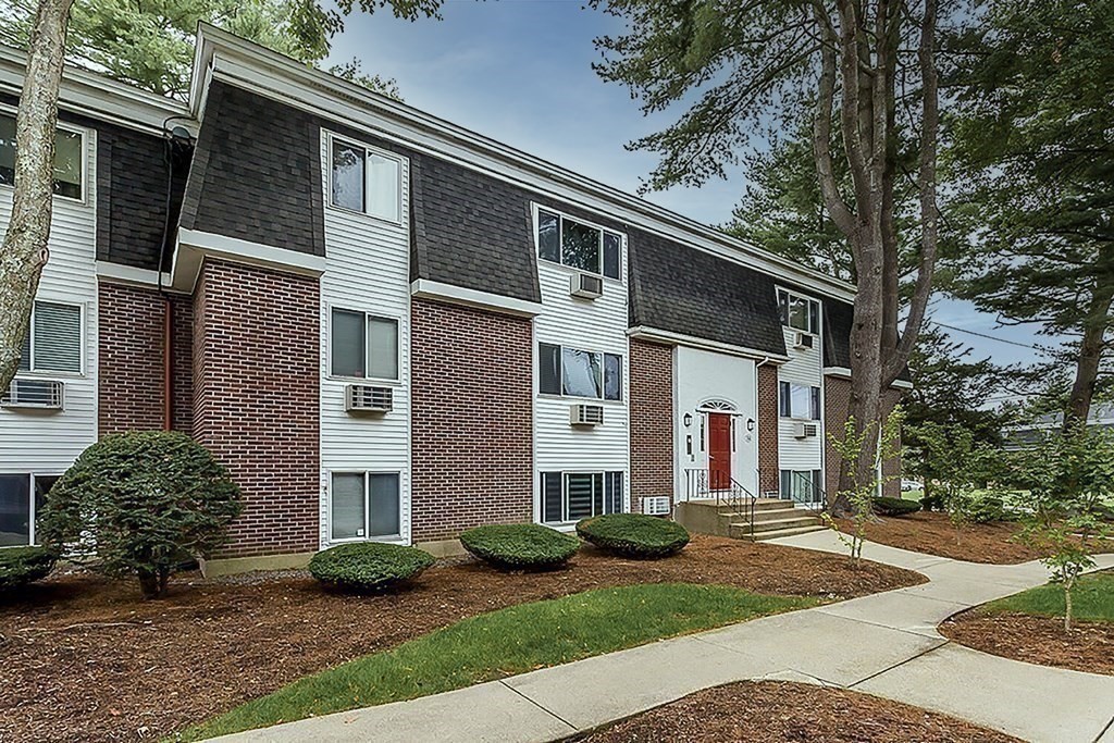 57 Will Drive, Unit 170 Canton, MA 02021 - Photo 15 of 15 a front view of a house with garden