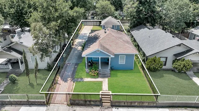 an aerial view of a house with swimming pool